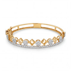 Beautiful 18KT gold bracelet bangle showcasing geometric lattice detailing with sparkling diamonds in a luxurious openwork design on a white background.