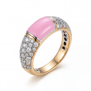 Luxurious 18KT gold ring featuring a pink cabochon center stone with pavé diamond side detailing and polished finish on a white background.