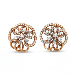 Elegant 18KT rose gold stud earrings featuring circular floral motifs with sparkling diamond accents on a white background.