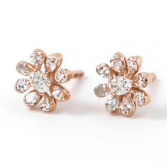 Elegant 18KT rose gold stud earrings featuring flower-shaped diamond clusters with sparkling center stones on a white background.