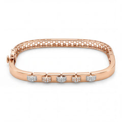 Beautiful 18KT rose gold bracelet showcasing sleek curved design with alternating diamond-set motifs on a white background.