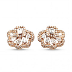 Elegant 18KT rose gold stud earrings featuring floral openwork design with baguette and pear-shaped diamonds on a white background.