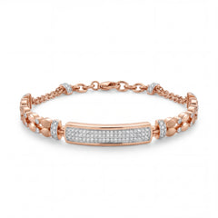 Elegant 18KT rose gold bracelet featuring a pavé diamond center bar with designer side links on a white background.