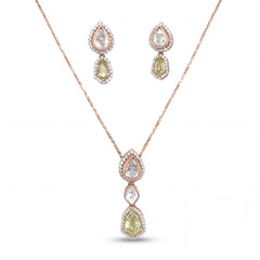 Elegant 18KT rose gold pendant set featuring pear and cushion-cut gemstone drops with diamond halo detailing and matching earrings on a white background.