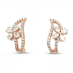 Elegant 18KT rose gold hoop earrings featuring floral diamond clusters with pavé diamond curved frames on a white background.