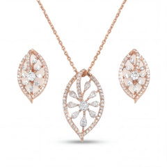 Elegant 18KT rose gold pendant set featuring leaf-shaped diamond pendant with matching floral earrings on a white background.