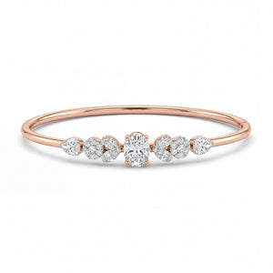 Elegant 18KT rose gold bangle featuring a central round solitaire diamond with pear-shaped side diamonds in a sleek minimalist design on a white background.