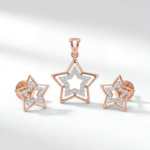 Elegant 18KT rose gold pendant set featuring a modern open star design with a sparkling diamond-studded inner star. The set includes a matching pendant and a pair of stud earrings, combining contemporary geometric styling with brilliant diamond accents for a chic and timeless look.