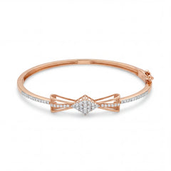 Beautiful 18KT rose gold bangle showcasing slim diamond-set bands with an intricate bow centerpiece on a white background.