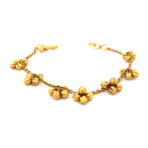 Stylish 18K gold chain bracelet with multiple flower-inspired charms in a graceful traditional design by Pachchigar Jewellers Ashokbhai