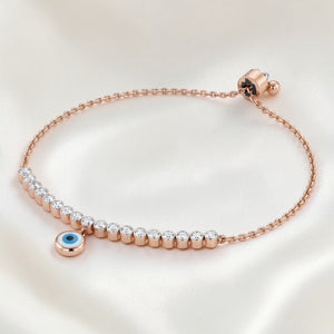 Stylish 18K rose gold adjustable nazar diamond bracelet with brilliant diamonds and protective blue evil eye charm by Pachchigar Jewellers Ashokbhai