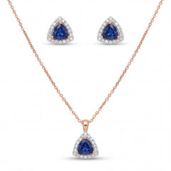 Elegant 18K rose gold blue sapphire diamond pendant earrings set featuring trillion cut blue sapphires with diamond halo necklace and matching stud earrings by Pachchigar Jewellers Ashokbhai