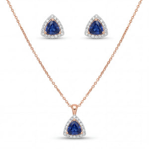 Elegant 18K rose gold blue sapphire diamond pendant earrings set featuring trillion cut blue sapphires with diamond halo necklace and matching stud earrings by Pachchigar Jewellers Ashokbhai