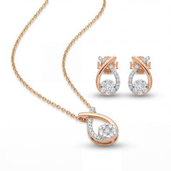 Elegant 18K rose gold diamond teardrop pendant earrings set featuring modern twist teardrop pendant with matching diamond drop earrings by Pachchigar Jewellers Ashokbhai