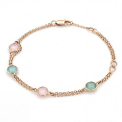 Stylish 18K rose gold bracelet with round pastel gemstones in blush pink and aqua tones linked on a graceful double chain crafted by Pachchigar Jewellers Ashokbhai