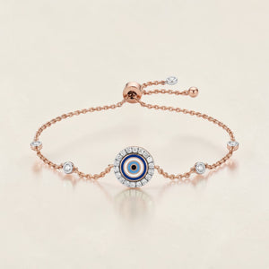 Luxurious 18K rose gold nazar diamond charm bracelet featuring evil eye centerpiece with enamel detailing, diamond accents and sliding adjustable chain by Pachchigar Jewellers Ashokbhai