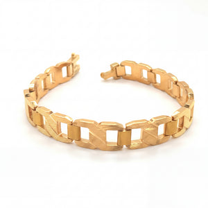 Stylish 22KT yellow gold bracelet featuring bold rectangular textured links with open geometric cutout detailing on a white background.