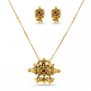 Elegant 22KT yellow gold pendant set featuring an antique-inspired necklace pendant with ruby center stone, dangling gold beads, and matching stud earrings on a white background.