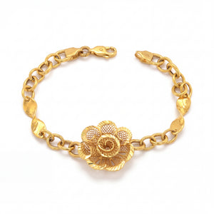 Elegant 22K yellow gold bracelet featuring a detailed floral filigree centerpiece with textured chain links and a secure clasp on a white background.