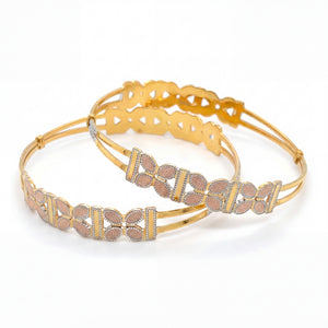 Stylish 22K yellow gold openable kada pair featuring rose gold leaf filigree motifs with white rhodium borders and elegant dual-band design.