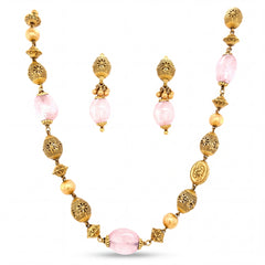 Elegant 22K yellow gold necklace set featuring pink rose quartz beads, intricate filigree gold beads, decorative accents, and matching drop earrings.