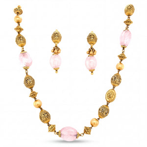 Elegant 22K yellow gold necklace set featuring pink rose quartz beads, intricate filigree gold beads, decorative accents, and matching drop earrings.