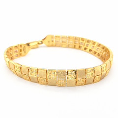Elegant 22K yellow gold bracelet featuring rectangular textured links with geometric detailing, polished finish, and secure clasp on a white background by Pachchigar Jewellers Ashokbhai.