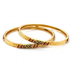 Beautiful 22K yellow gold pair bangles featuring traditional meenakari enamel detailing in red and black floral patterns with elegant textured accents.
