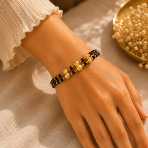 Black Bead Gold Bracelet with Floral Accents