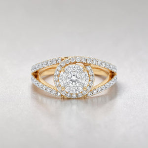 Yellow gold diamond ring featuring a round brilliant center stone encircled by a halo of diamonds, with a split shank band adorned with pavé-set diamonds for added sparkle.