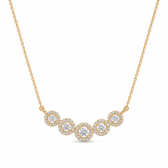 Elegant gold necklace featuring five sparkling round diamond halo motifs arranged in a graceful curved design on a white background.
