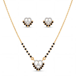 Elegant gold mangalsutra jewelry set featuring black beads, a heart-shaped diamond pendant, and matching heart stud earrings on a white background.