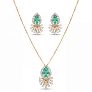 Elegant gold jewelry set featuring teardrop-shaped emerald gemstones with sparkling diamond halo detailing in a pendant necklace and matching earrings on a white background.