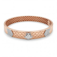 Rose gold kada featuring a honeycomb-textured design with a central panther head motif in white gold, accented by diamond-set panels on the sides for a bold and contemporary look.