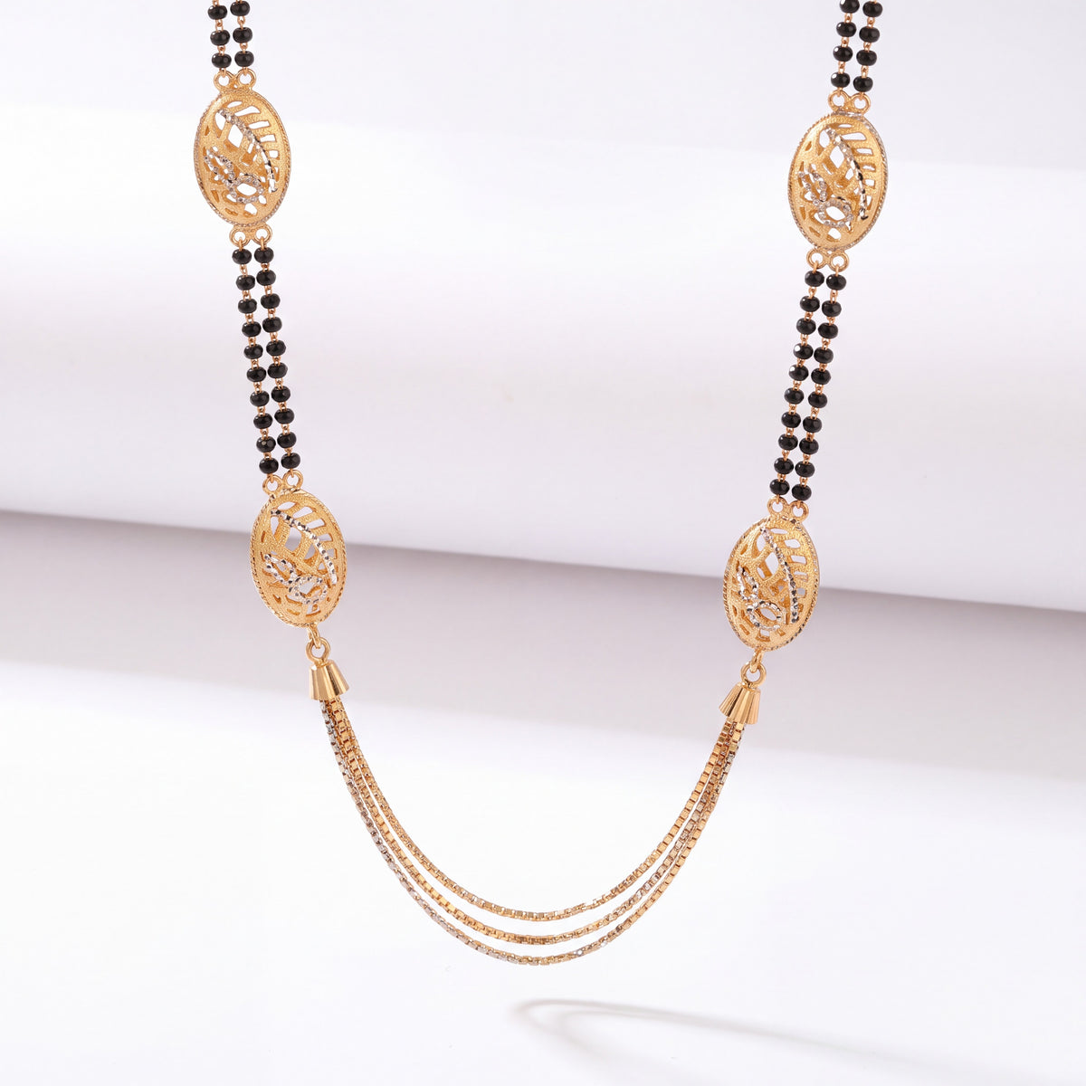 Gold Mangalsutra with Oval Motifs & Triple-Layered Gold Chain