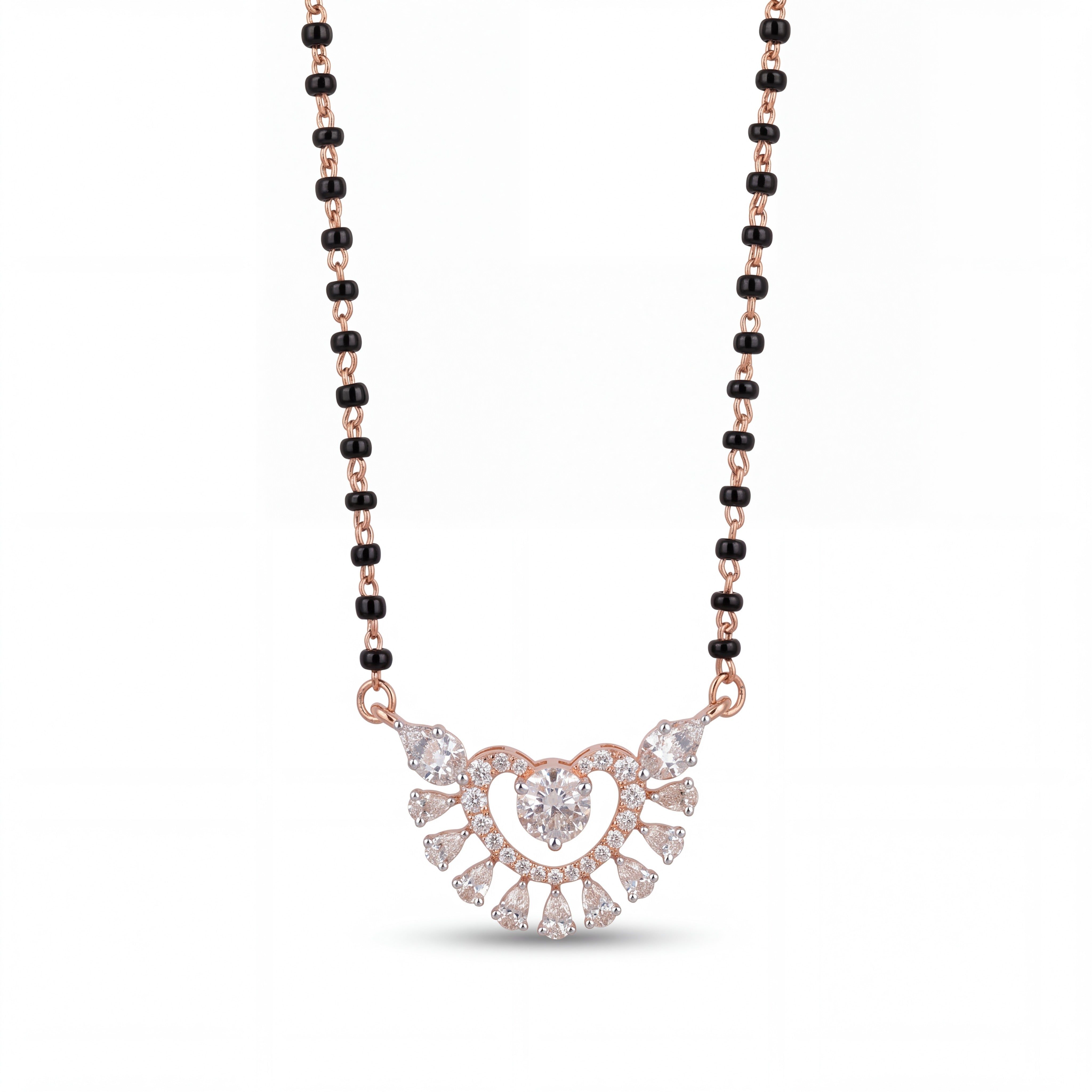 Elegant rose gold mangalsutra necklace featuring black beads and a sparkling heart-shaped floral diamond pendant with intricate detailing on a white background.