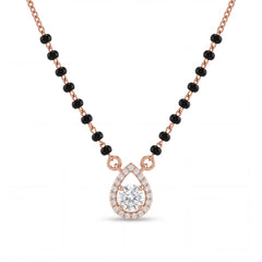 Elegant rose gold mangalsutra necklace featuring black beads and a sparkling teardrop-shaped diamond pendant with halo detailing on a white background.