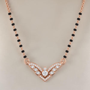 Elegant rose gold mangalsutra necklace featuring black beads and a sparkling V-shaped diamond pendant with wing-inspired detailing on a white background.