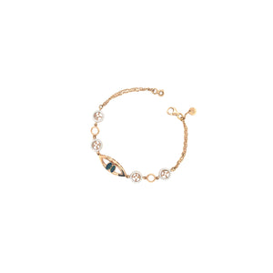 Stylish rose gold bracelet featuring an evil eye centerpiece with blue opal accents and sparkling circular diamond motifs on a delicate chain with adjustable clasp.
