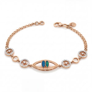 Stylish rose gold bracelet featuring an evil eye centerpiece with blue opal accents and sparkling circular diamond motifs on a delicate chain with adjustable clasp.