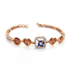 Elegant rose gold bracelet featuring heart motifs, a square blue sapphire centerpiece, and sparkling diamond accents with an adjustable clasp on a white background.