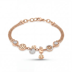 Elegant rose gold charm bracelet featuring snowflake motifs, sparkling diamond accents, and playful dangling charms on a multi-chain adjustable bracelet.