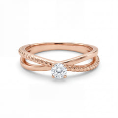 Rose gold ring with a diamond on a white background