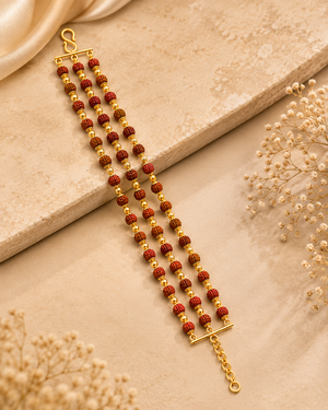 Three-strand gold bracelet featuring rows of Rudraksha beads with intricate gold bead detailing, connected by gold end bars and a secure adjustable clasp.
