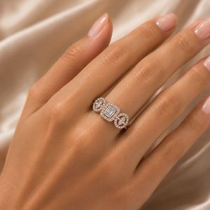 Elegant gold ring featuring three connected diamond-set motifs with a rectangular center design and oval-shaped side accents, creating a refined contemporary look.