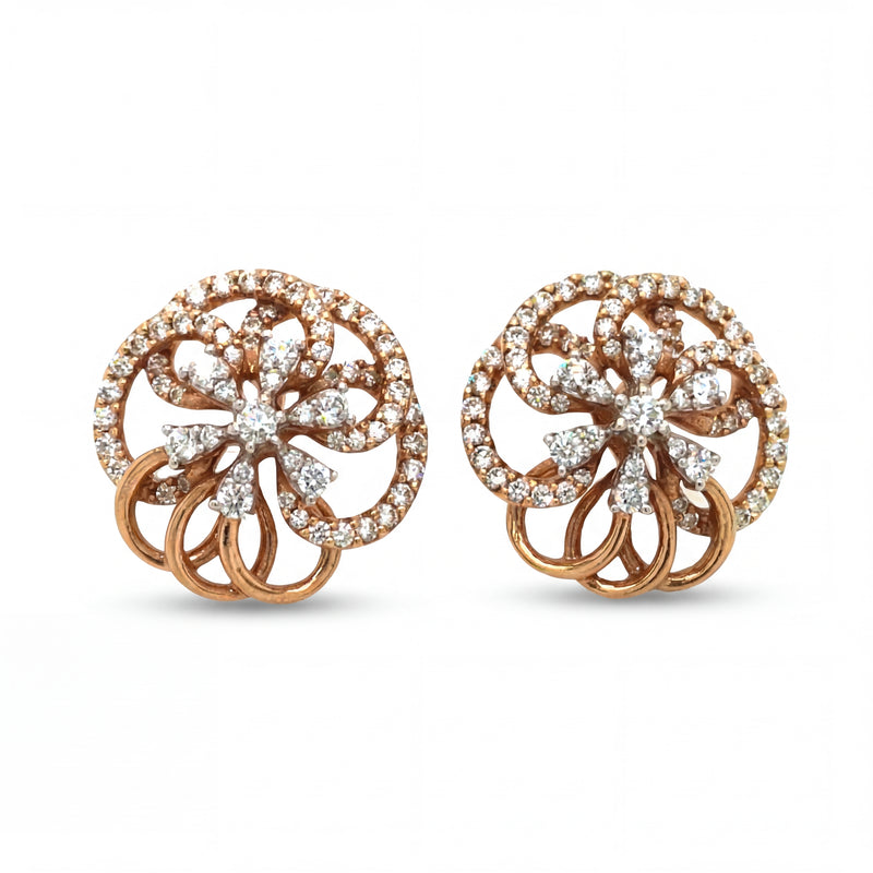 Elegant 18KT rose gold stud earrings featuring circular floral motifs with sparkling diamond accents on a white background.