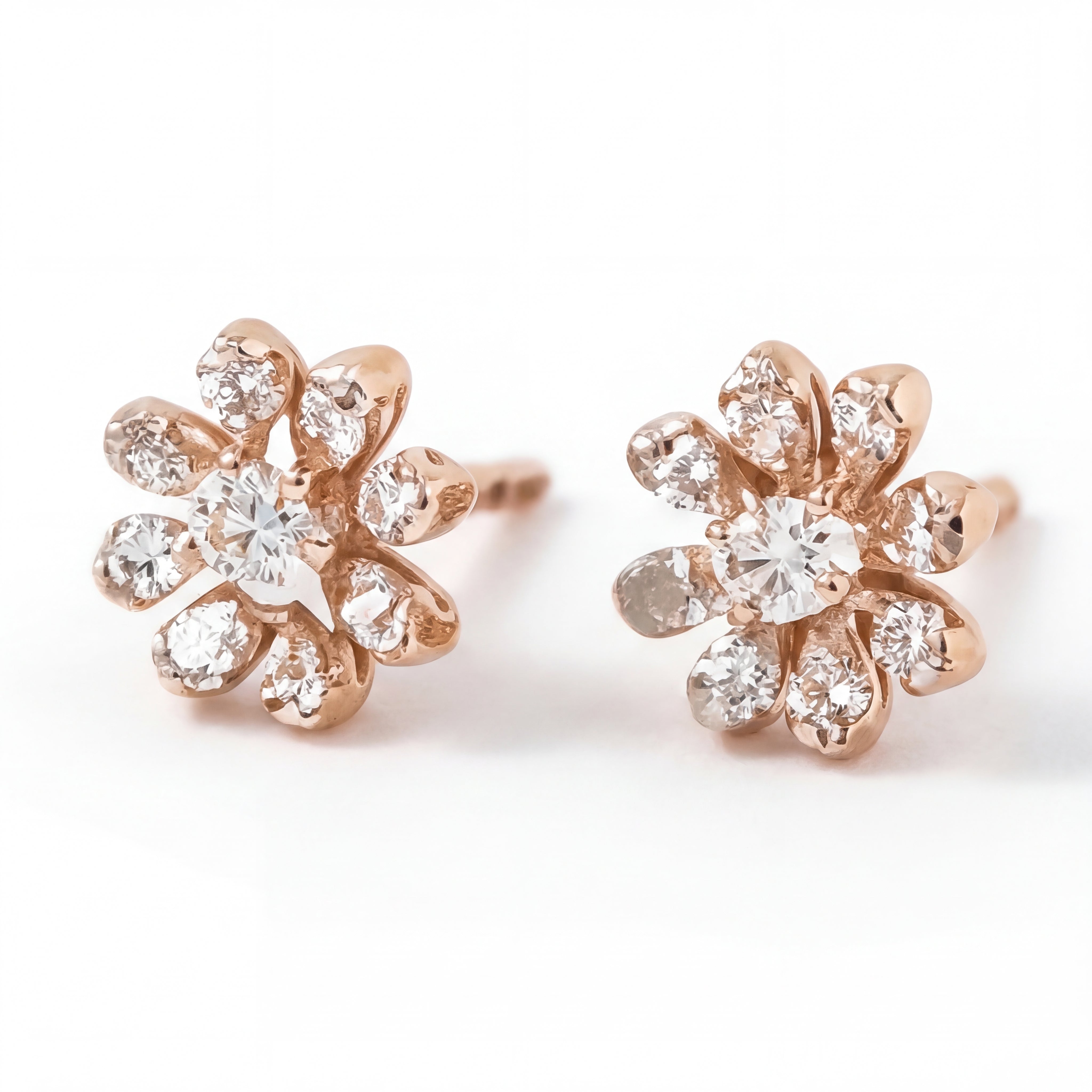 Elegant 18KT rose gold stud earrings featuring flower-shaped diamond clusters with sparkling center stones on a white background.