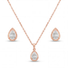 Beautiful 18KT rose gold jewelry set showcasing textured drop motifs with baguette and round diamond accents and matching earrings on a white background.