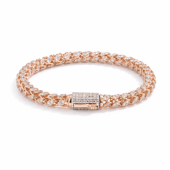 Luxurious 18KT rose gold bracelet showcasing woven diamond-studded links with a secure diamond clasp on a white background.