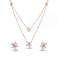 Stylish 18KT rose gold pendant set featuring a layered chain design with floral diamond pendants and coordinated earrings on a white background.